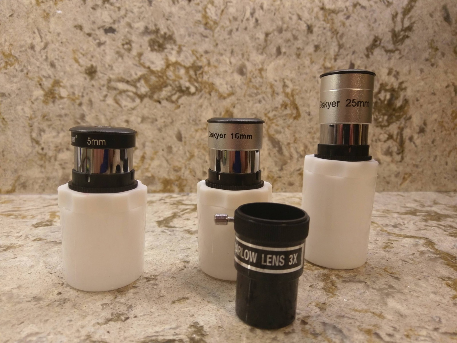Three eyepieces and one barlow lens