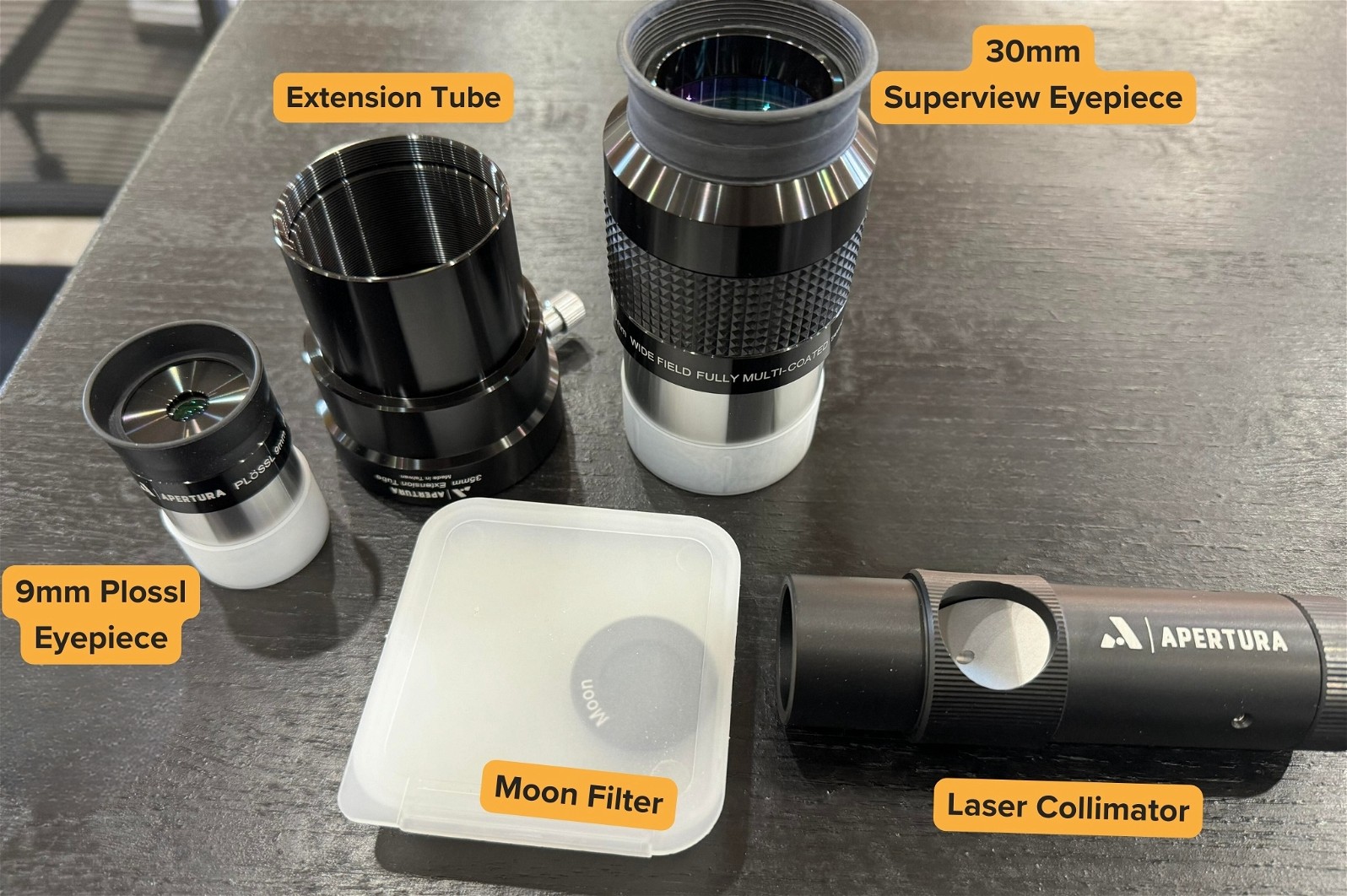 9mm Plossl, Extension Tube, 30mm Superview, Moon Filter and Laser Collimator. The accessories included with Apertura AD10.