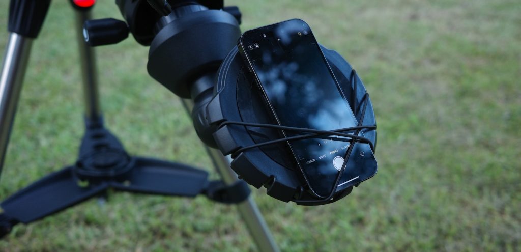 smartphone kept above the smartphone adapter in the Inspire 100AZ's eyepiece