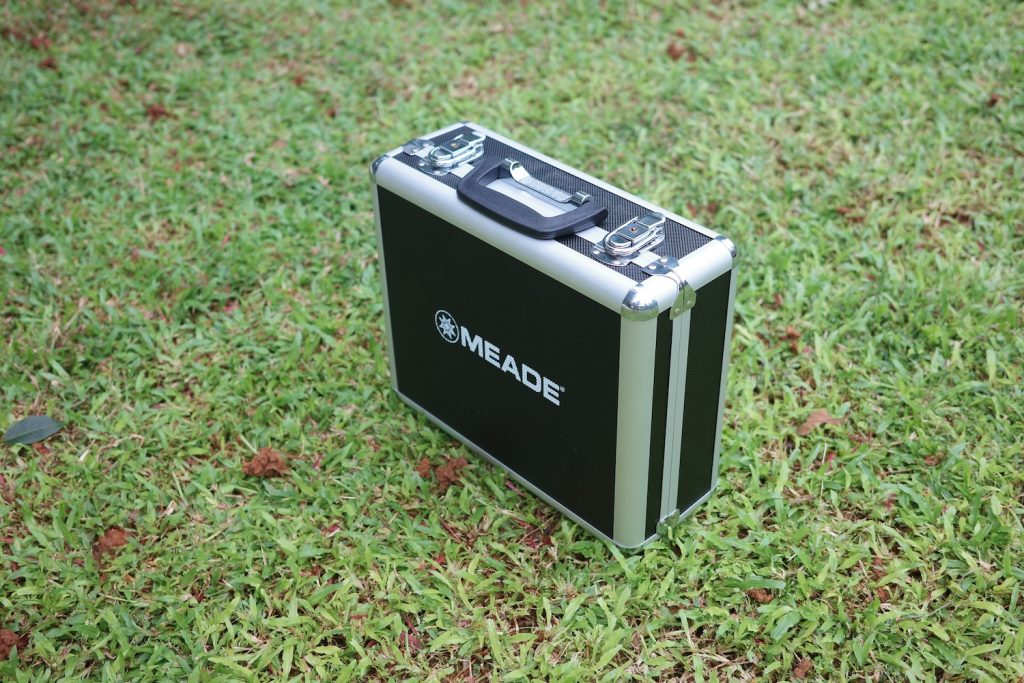 Meade carry case in a meadow