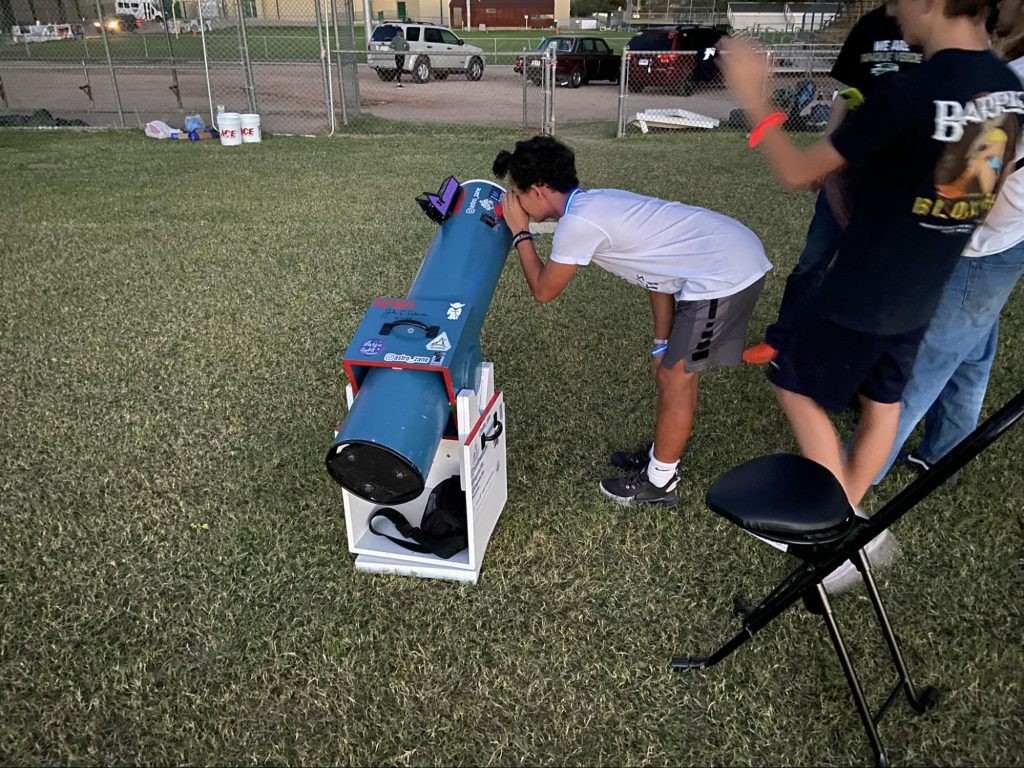Me conducting an outreach stargazing program with a custom built 8" dobsonian.