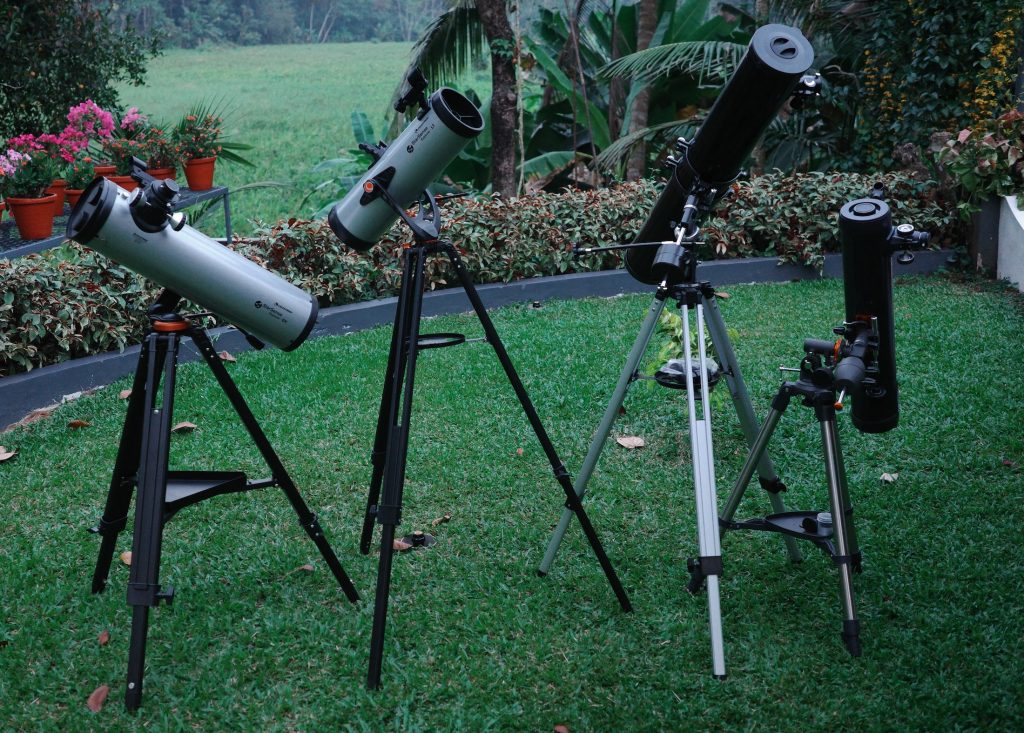 A few of the reflector telescopes on tripod that are currently on our collection